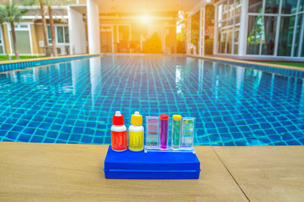 Testing and balancing pool water chemistry during weekly maintenance in Prosper, TX